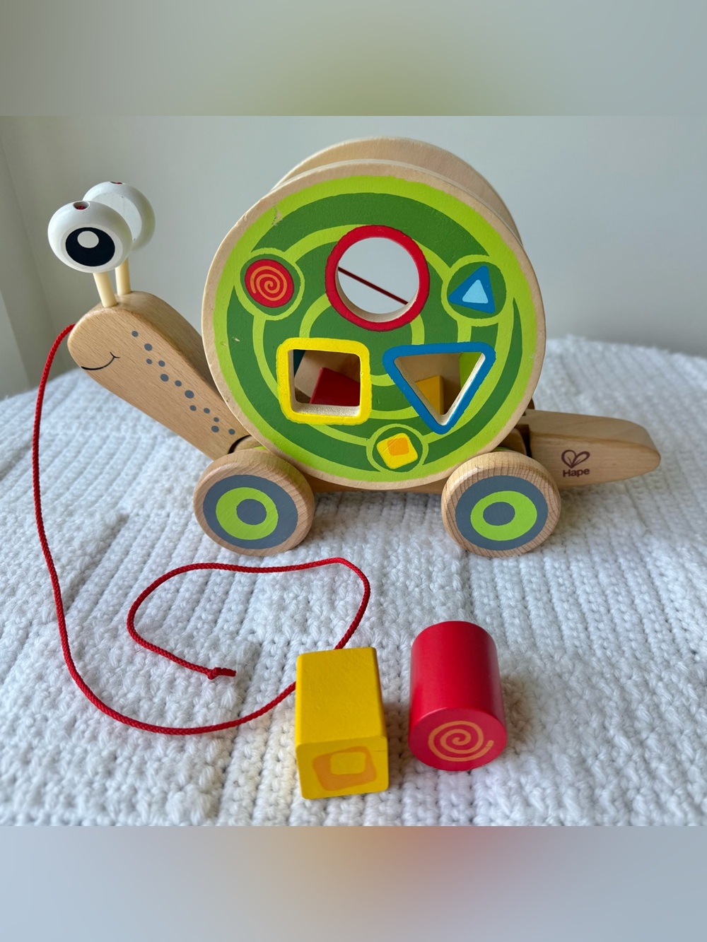 Hape Walk-A-Long Snail wooden pull toy